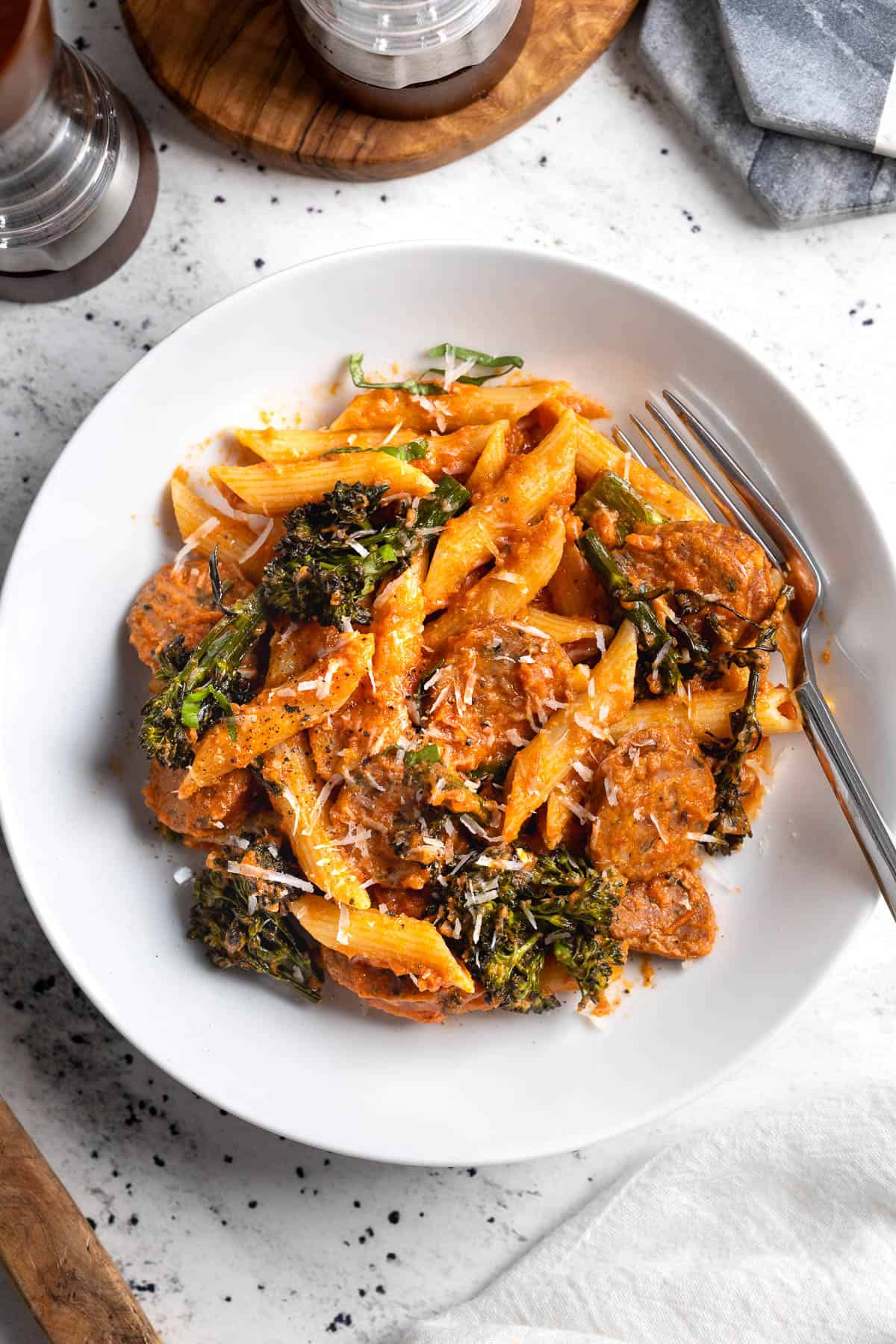 A serving of pasta in a shallow bowl with a fork.