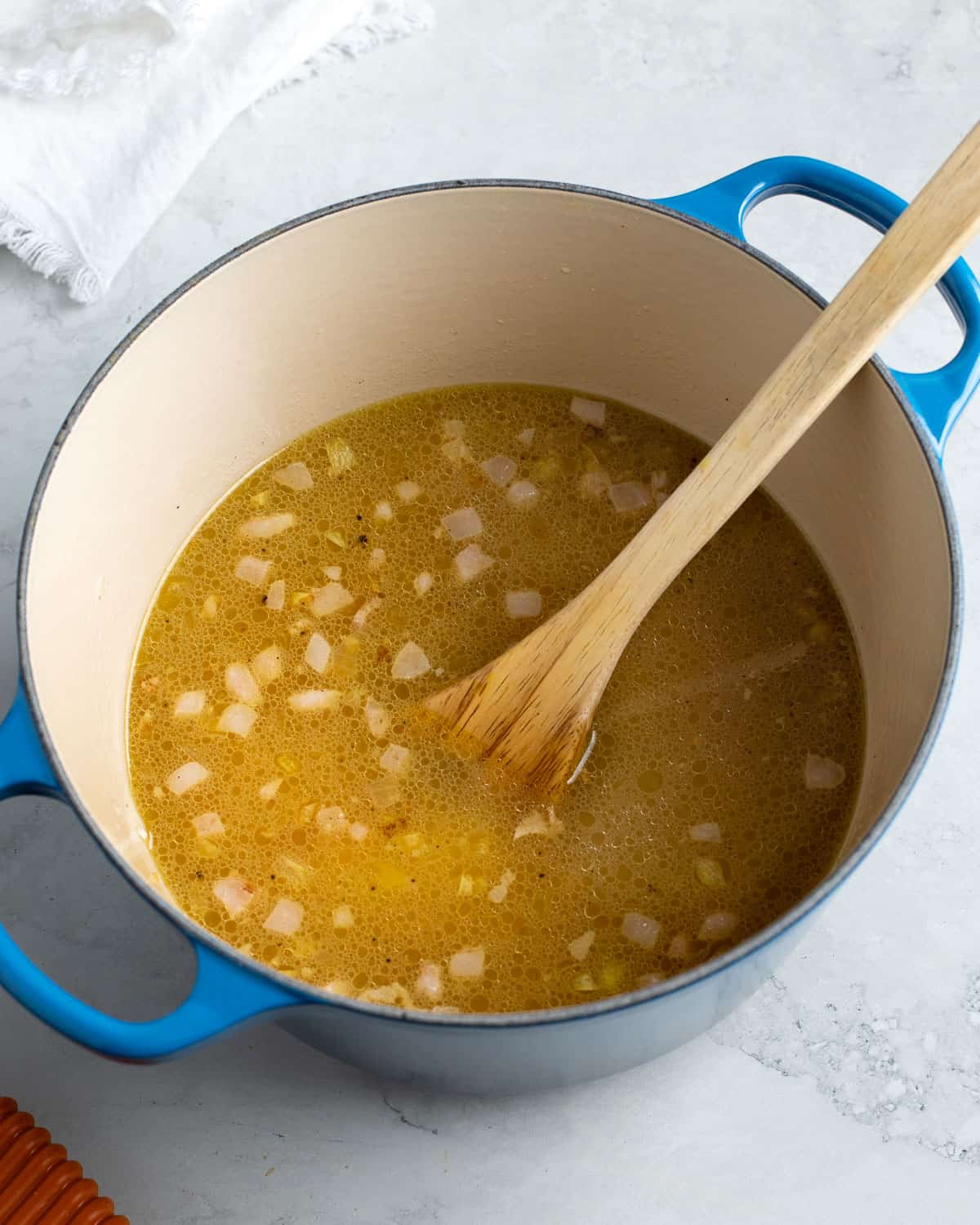 All liquid poured into the Dutch oven before baking the risotto.