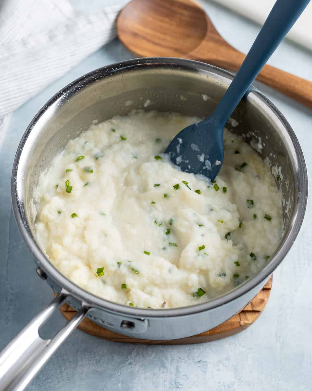 Stirring the potatoes as the instant flakes begin to rehydrate.