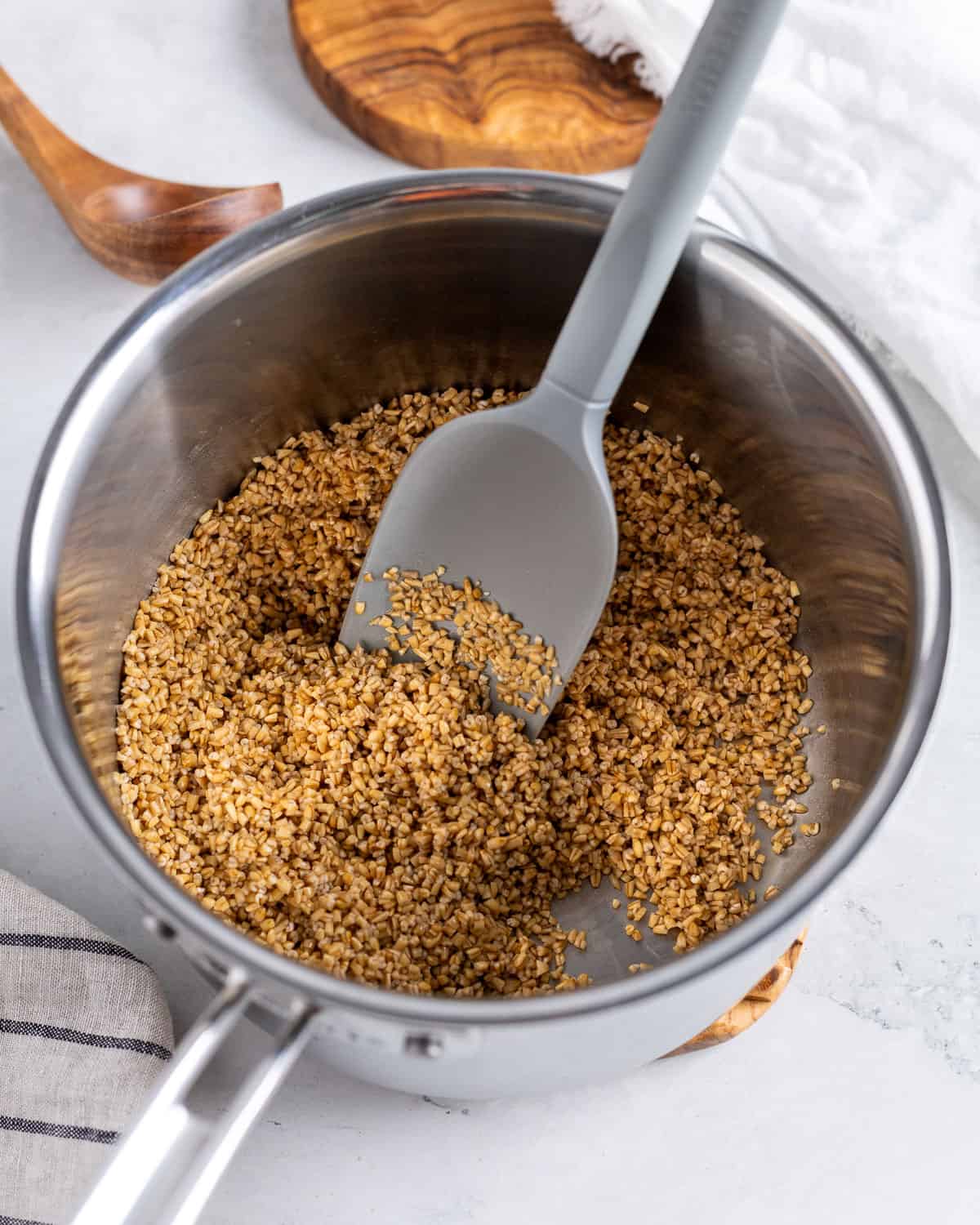 Toasted steel cut oats in a pot.