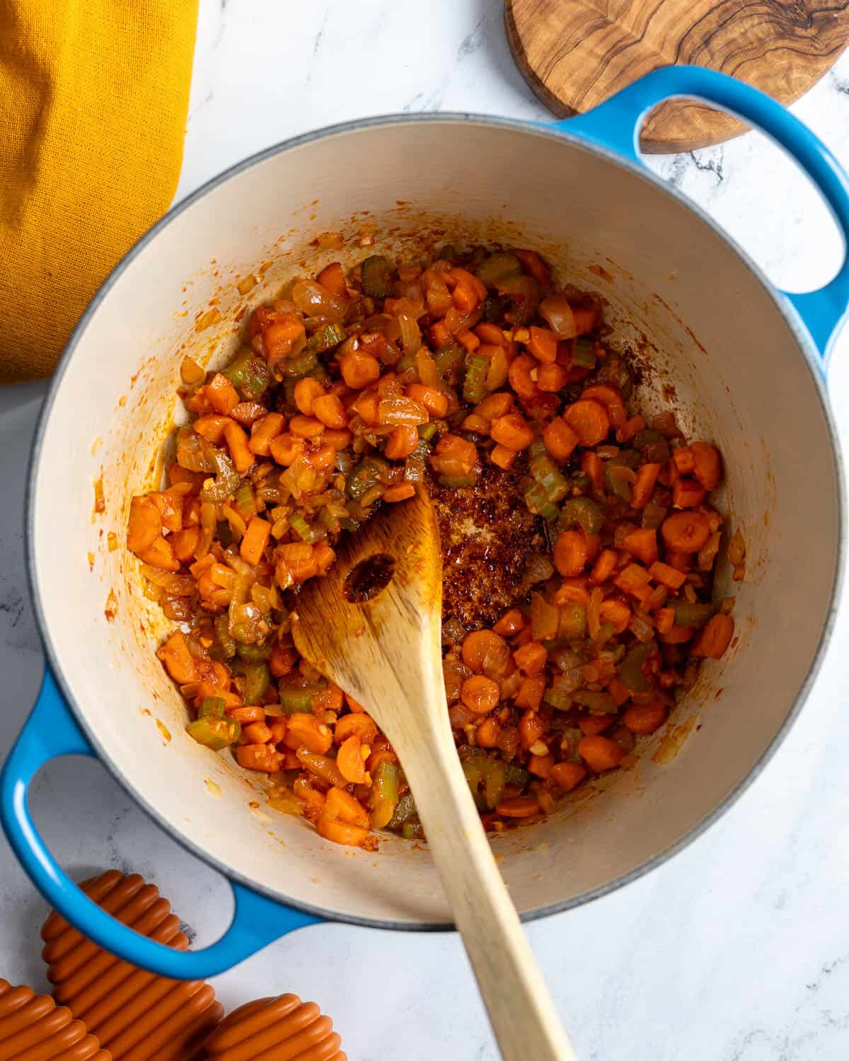 The tomato paste cooked in the pot with the vegetables for several minutes.