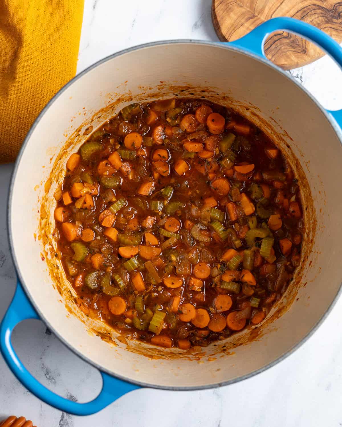 The vegetables in the pot deglazed with wine.