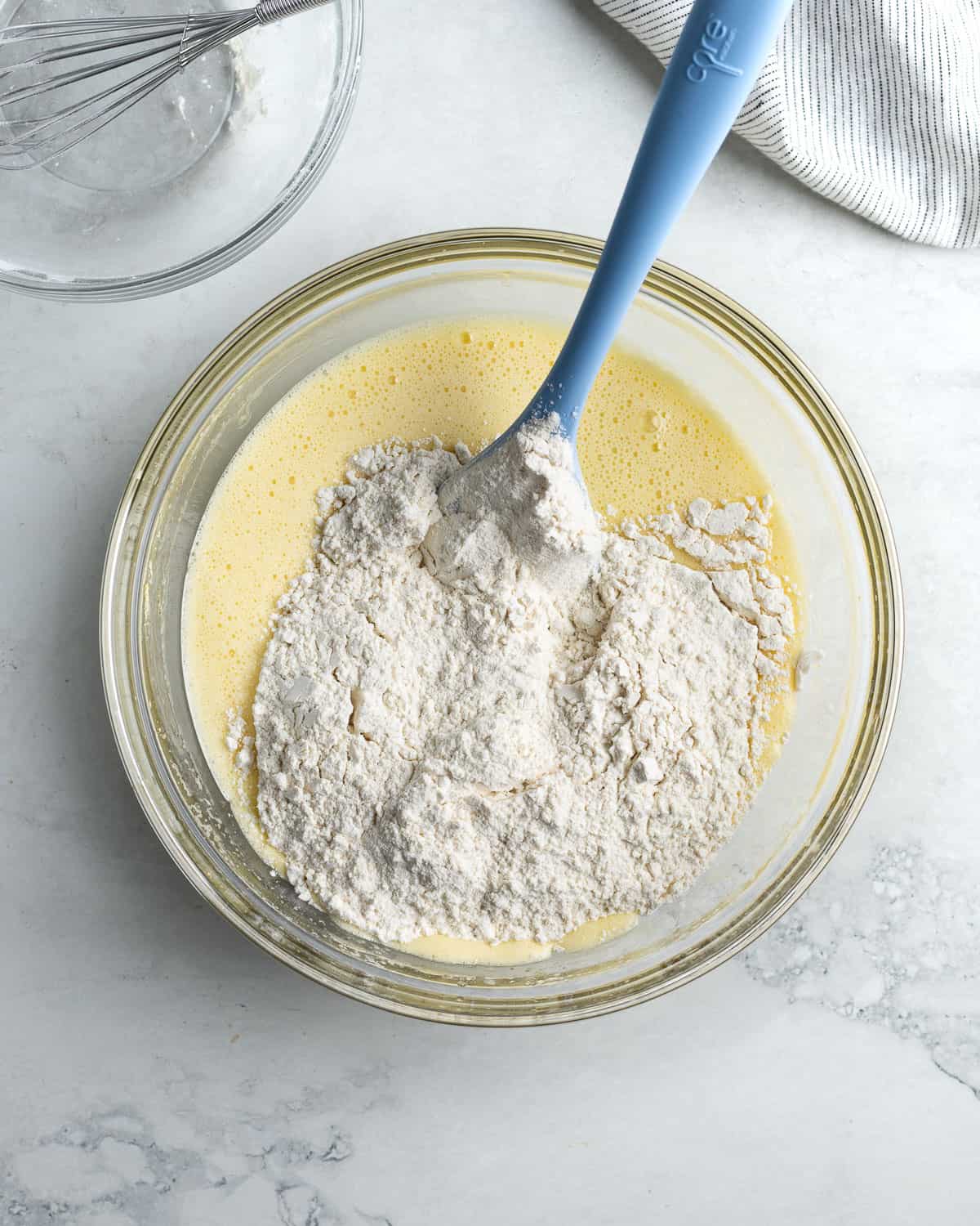 Dry ingredients poured into the bowl of wet ingredients.