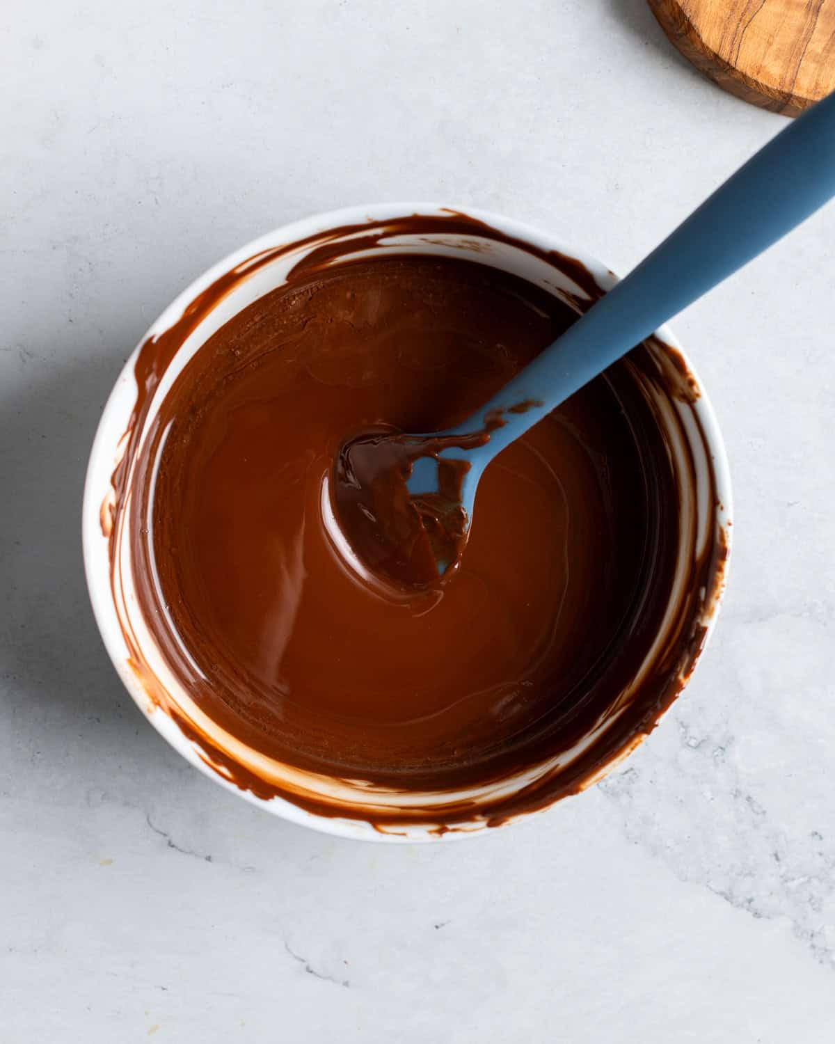Coconut oil and peppermint extract stirred into melted dark chocolate.