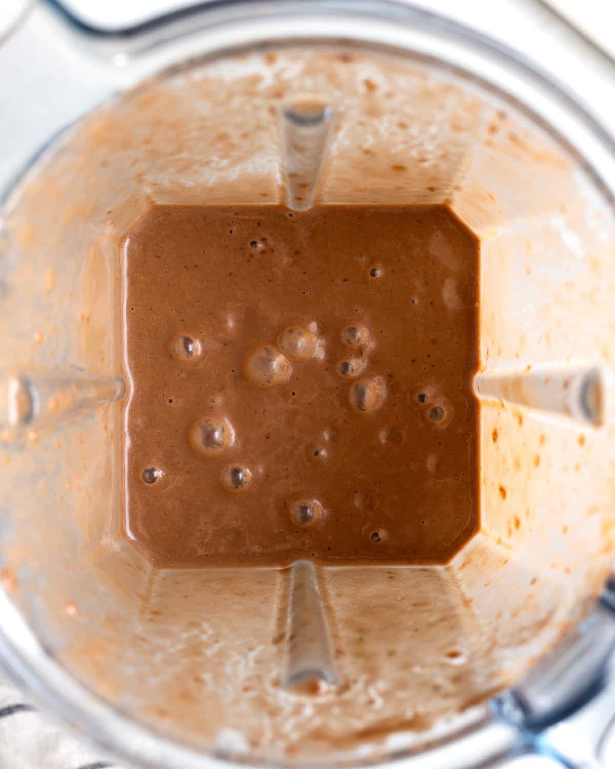 The smoothie in a blender ready to be poured.