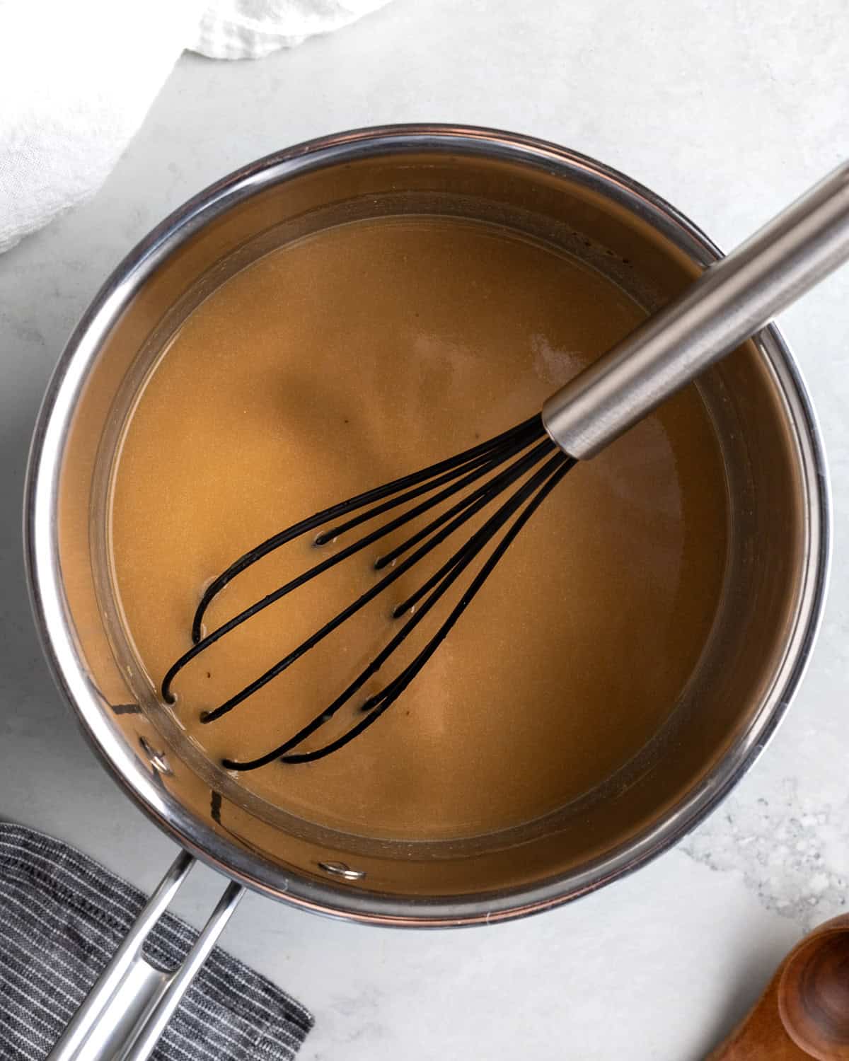 All gravy ingredients in the pan before thickening over the stove.