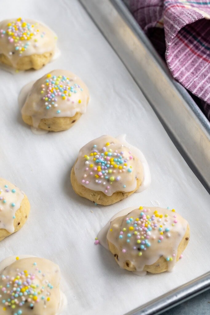 Iced Italian anise cookies decorated with pastel nonpareils.
