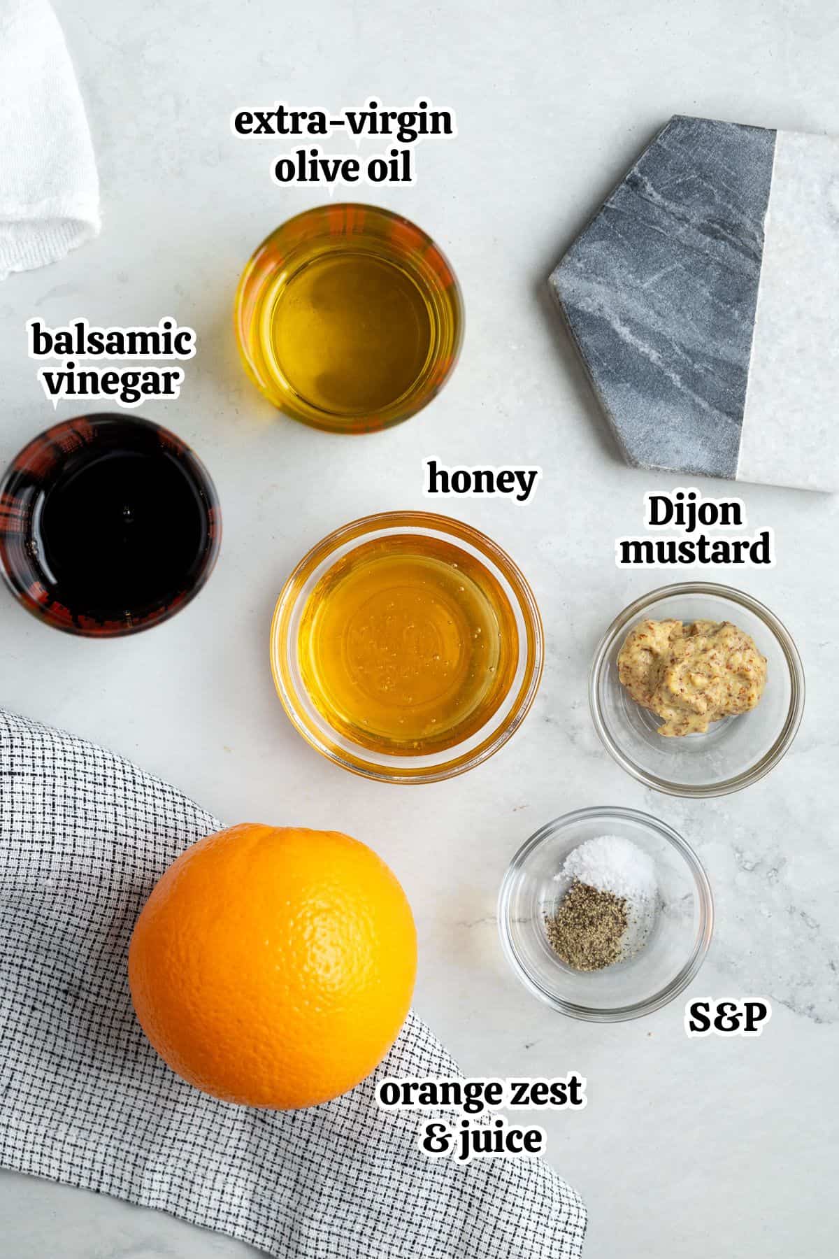 Text-labeled vinaigrette ingredients in separate containers.