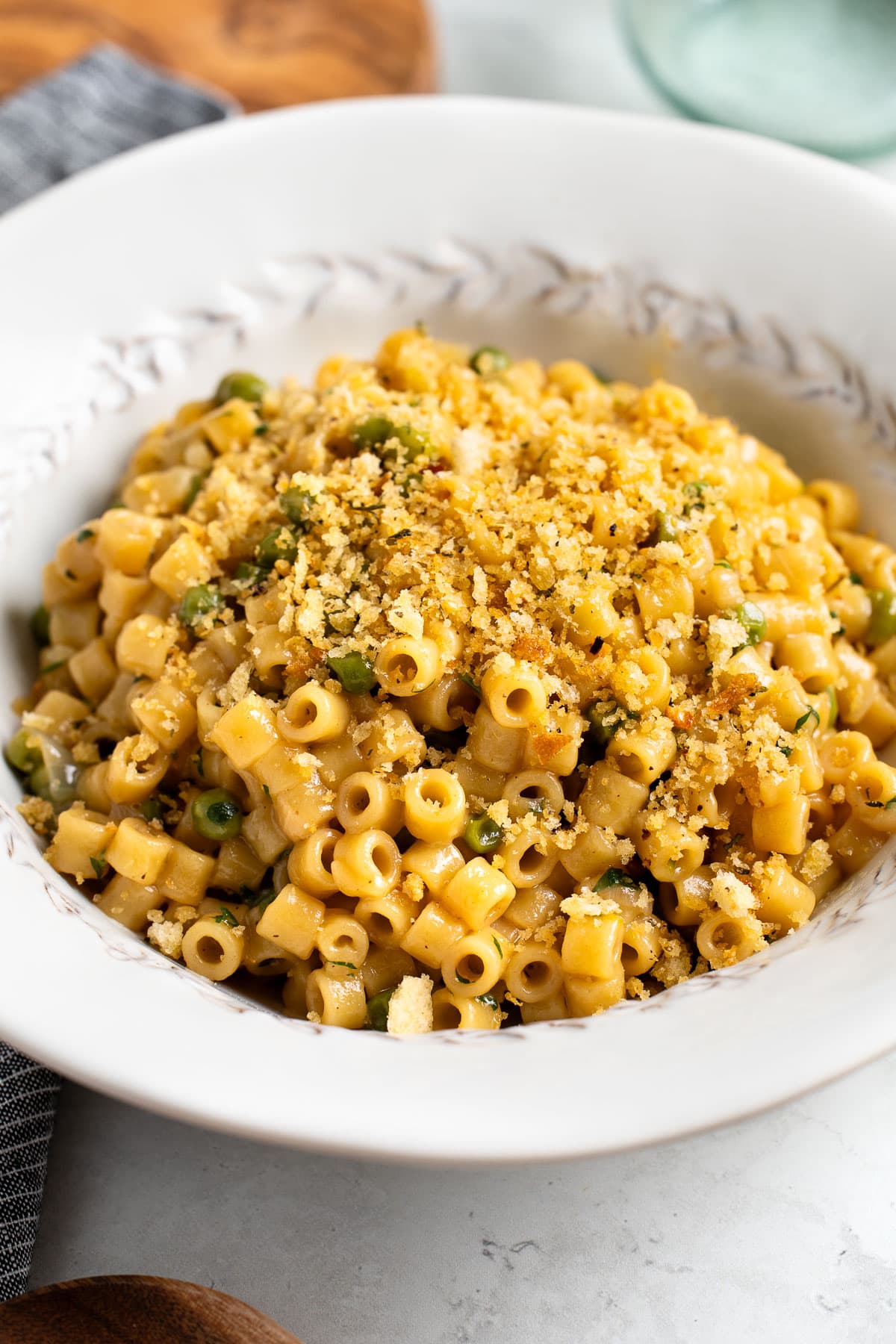 Italian toasted breadcrumbs garnishing a bowl of small-shape pasta.