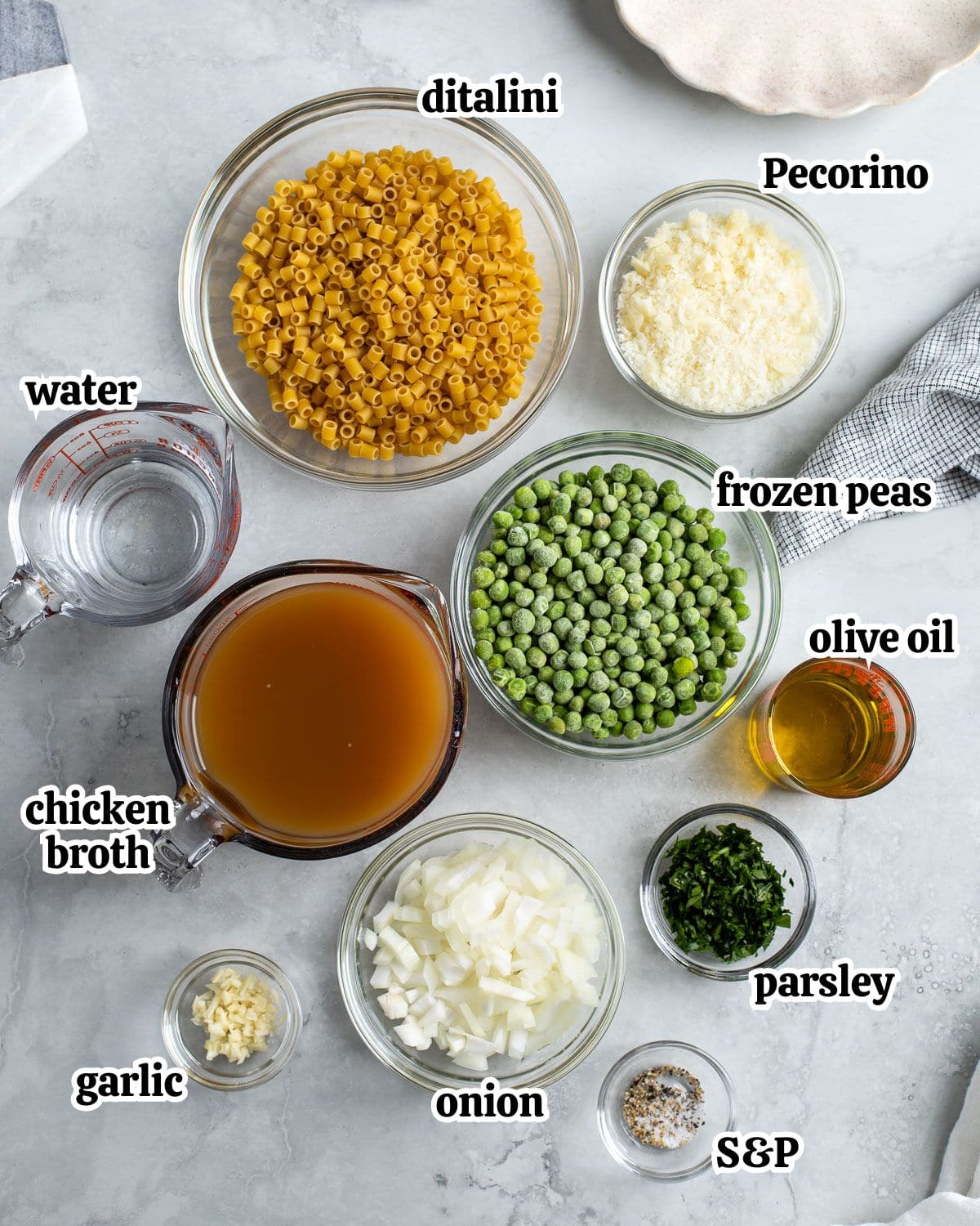 Pasta e piselli ingredients in separate bowls.