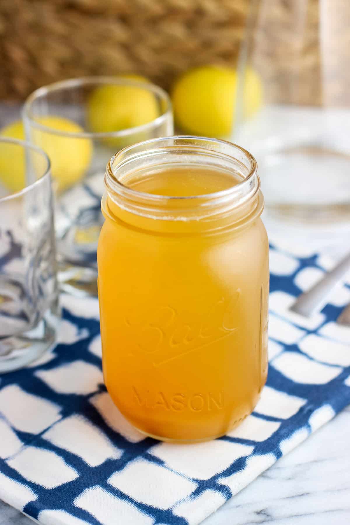 Lemon ginger simple syrup in a mason jar.