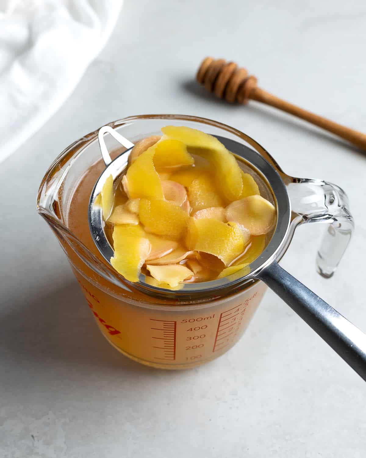 Straining the flavored simple syrup.
