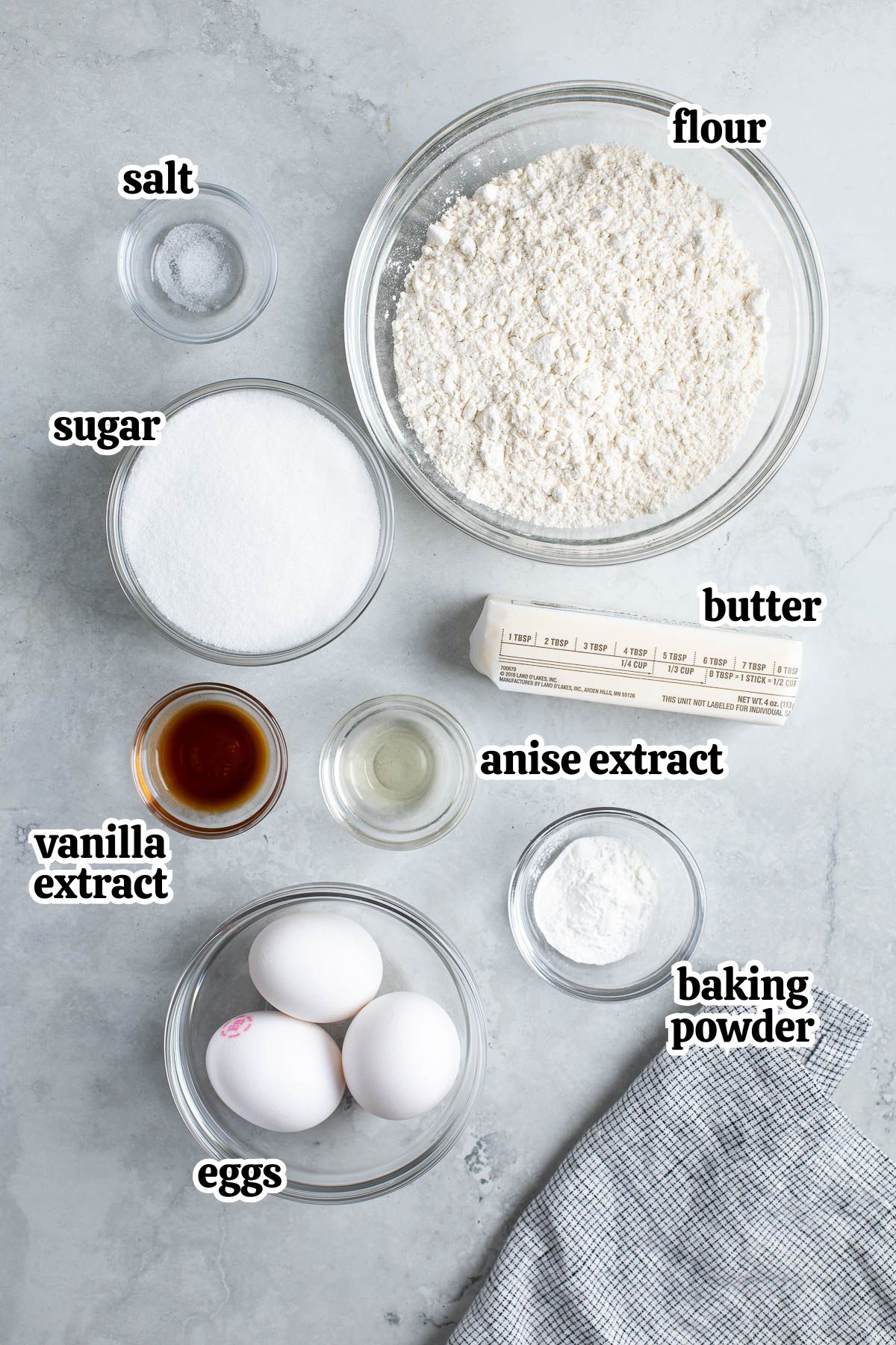 Text-labeled Italian pizzelle ingredients in separate bowls.