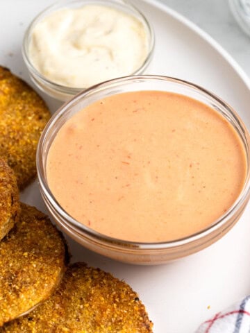 Comeback sauce in a bowl served with green tomatoes.