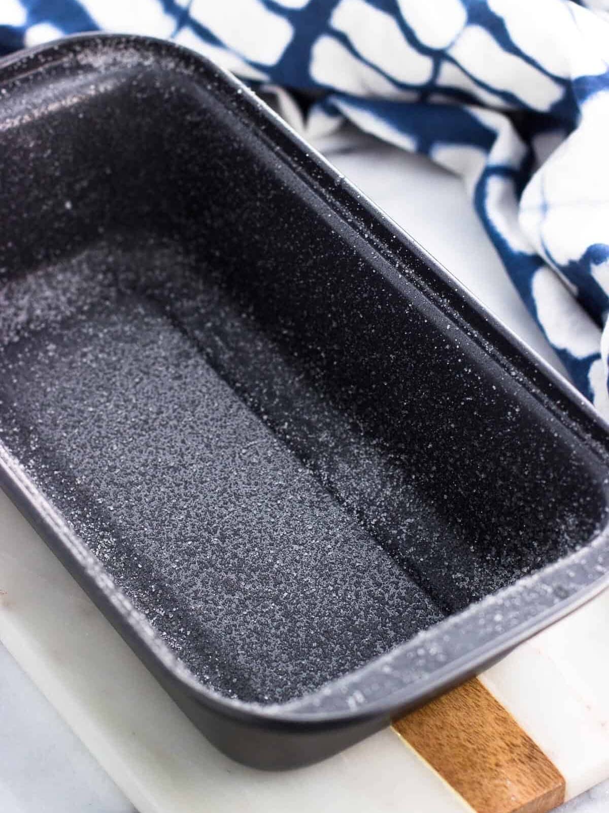 A greased and sugared loaf pan.