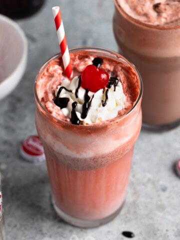 Two Cheerwine floats, one vanilla and one chocolate, with straws.