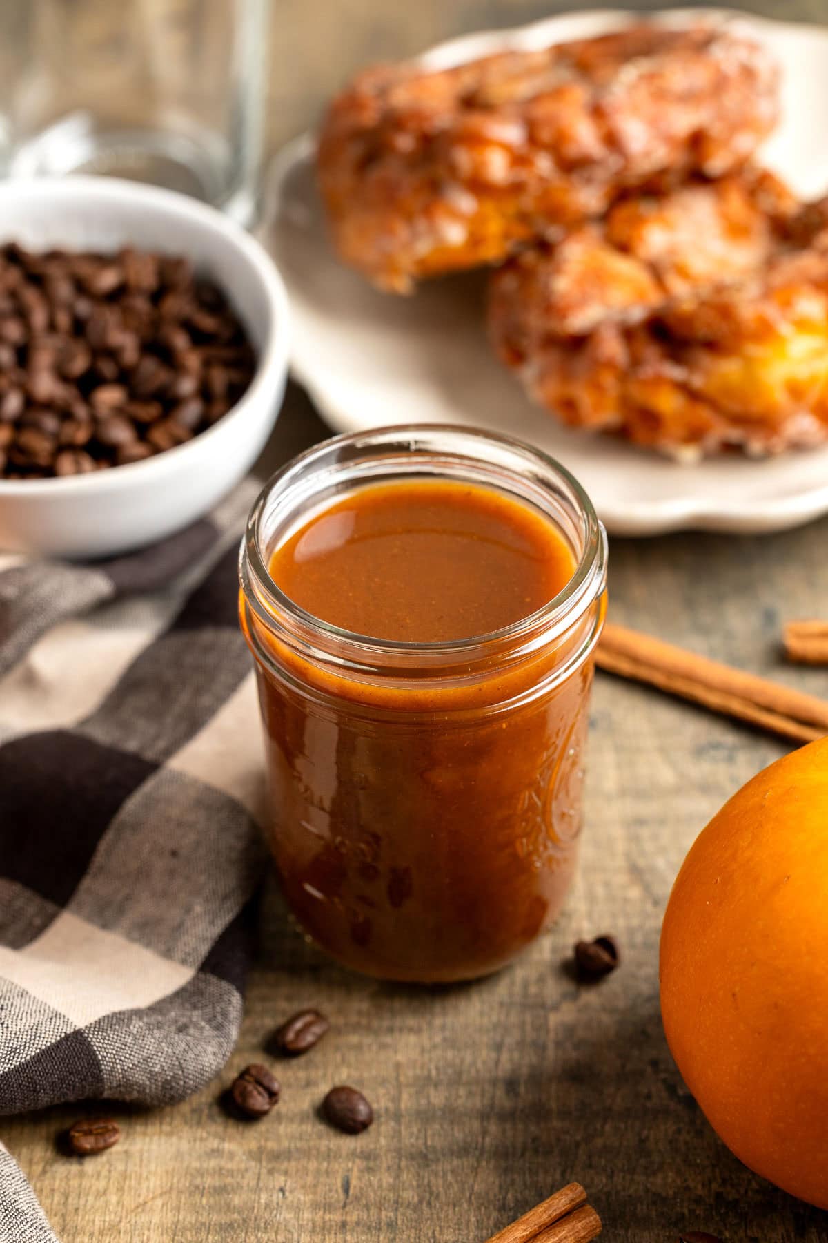 Maple pumpkin spice syrup in a glass jar.