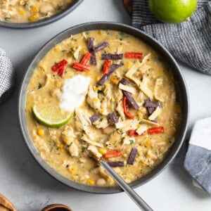 Thick white chicken chili in bowls ready to serve.