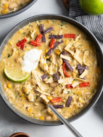 Thick white chicken chili in bowls ready to serve.