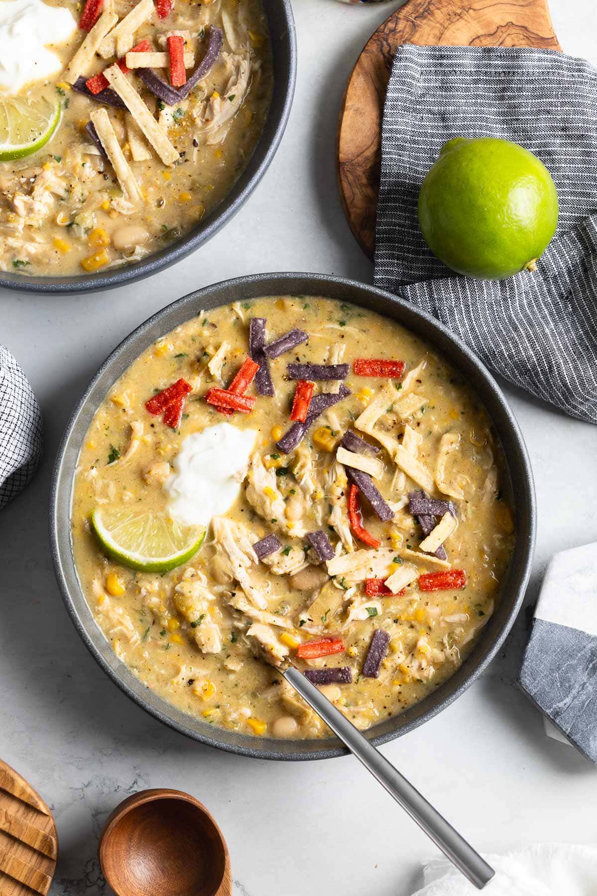 Thick white chicken chili in bowls ready to serve.