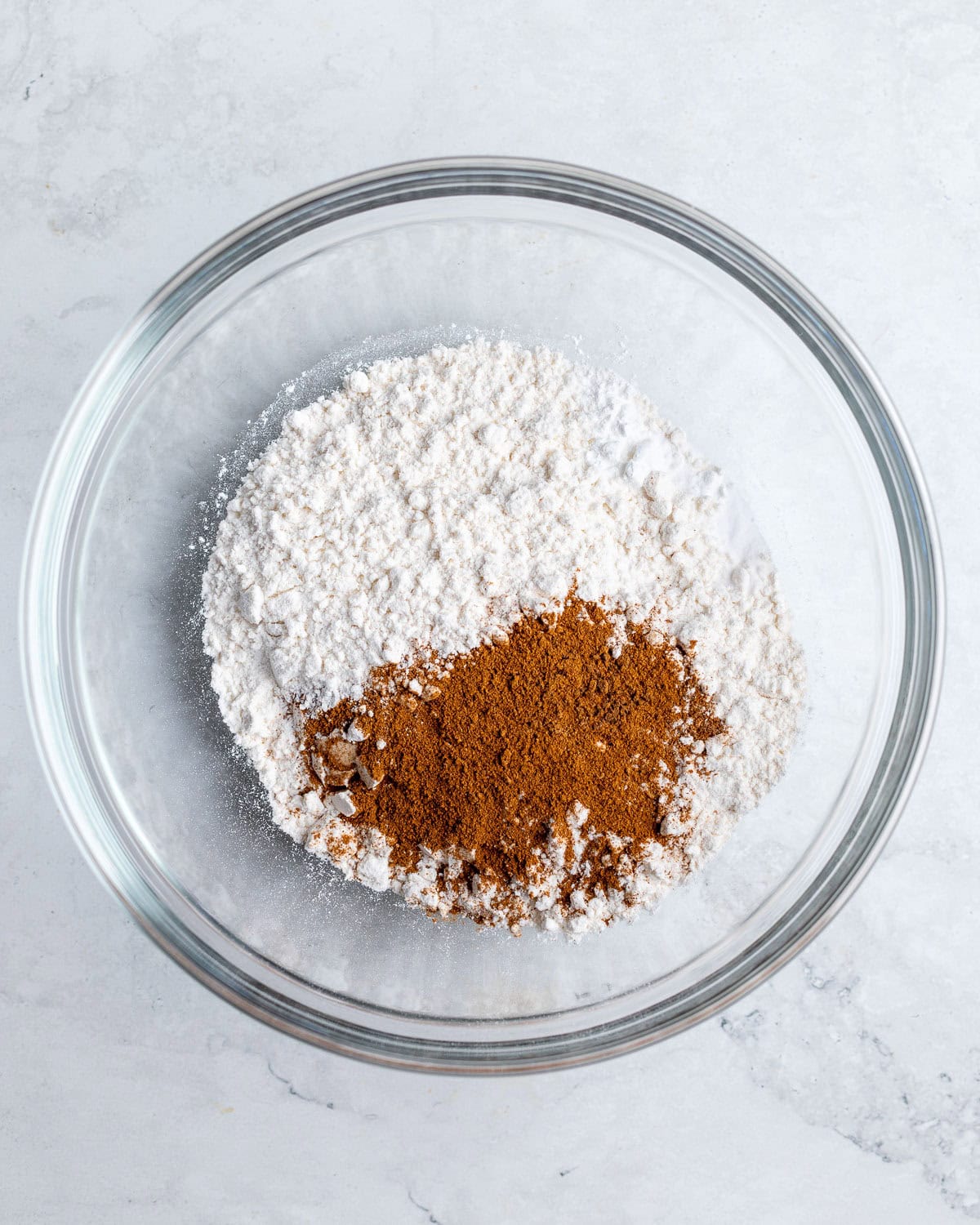 The cookie dry ingredients added to a bowl.