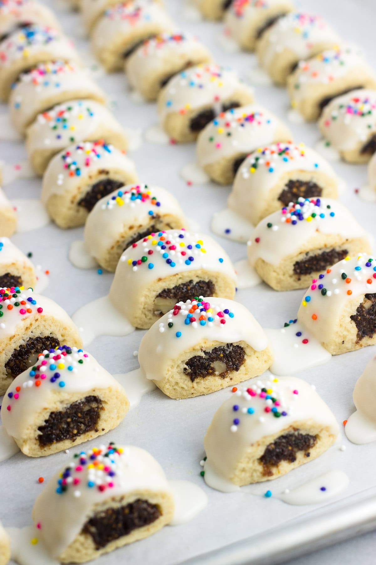 Lots of cucidati on a sheet pan drying.