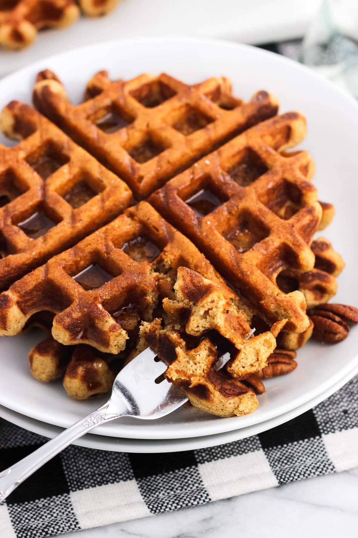 A forkful of gingerbread waffles.