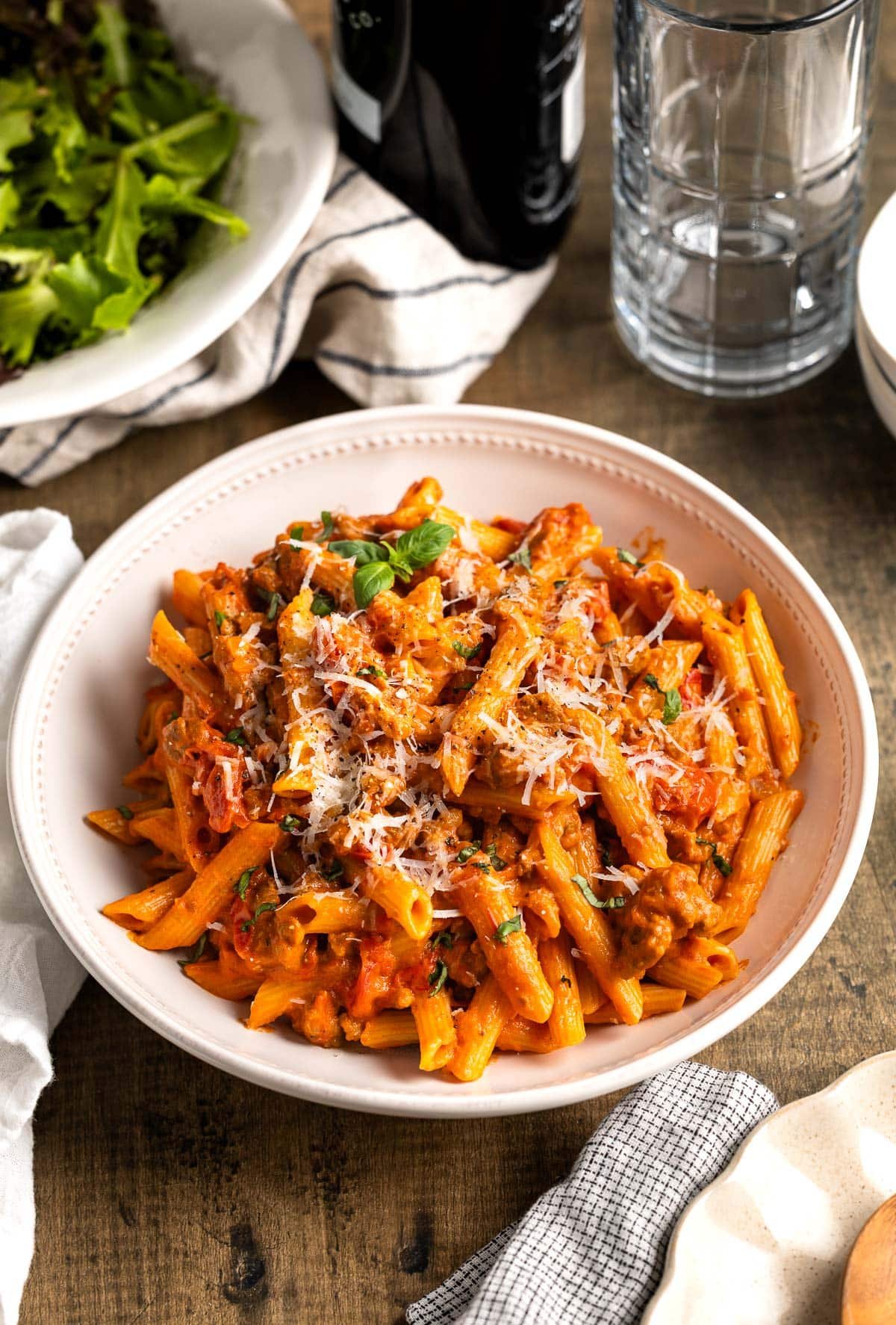 A serving bowl of penna alla vodka with sausage.