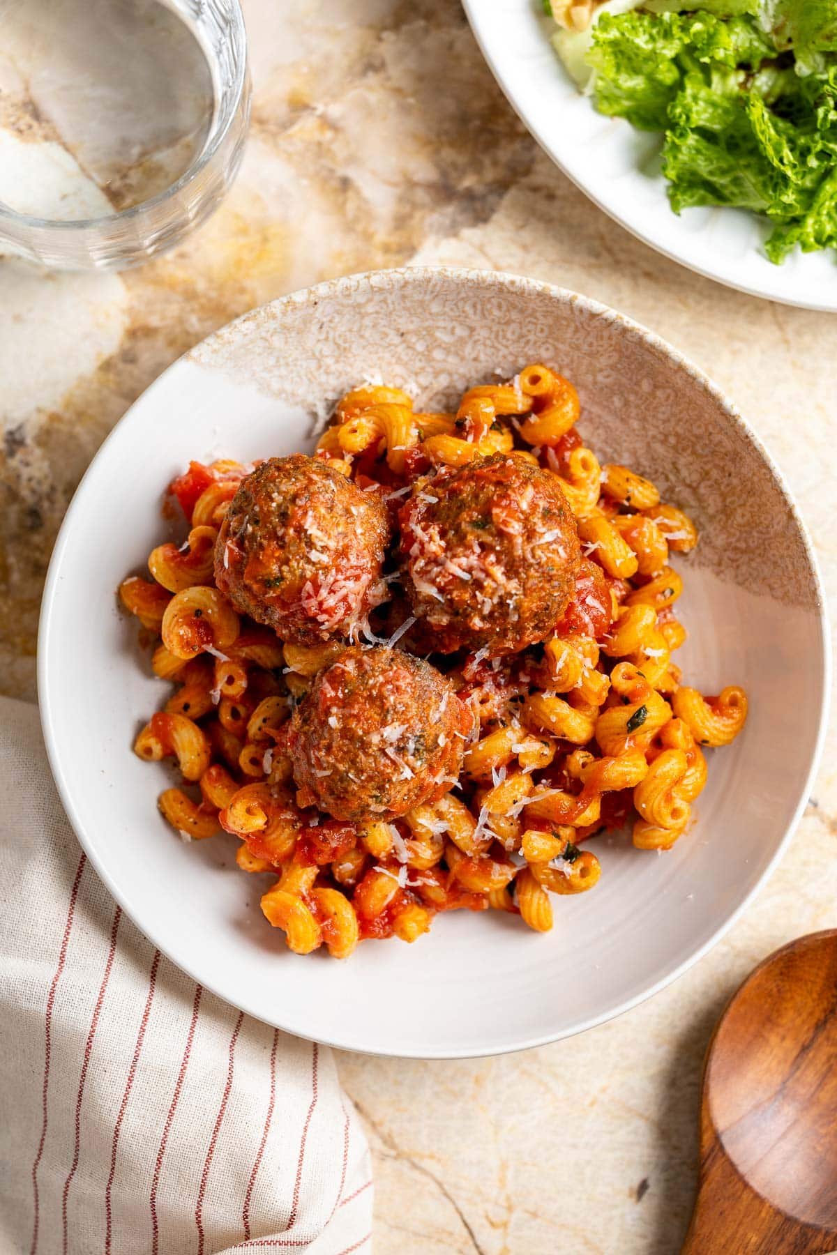 Protein pasta and turkey meatballs with flaxseed served with marinara sauce and grated Pecorino.