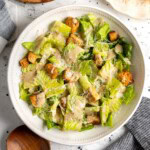A Caesar salad dressed with creamy Caesar vinaigrette.