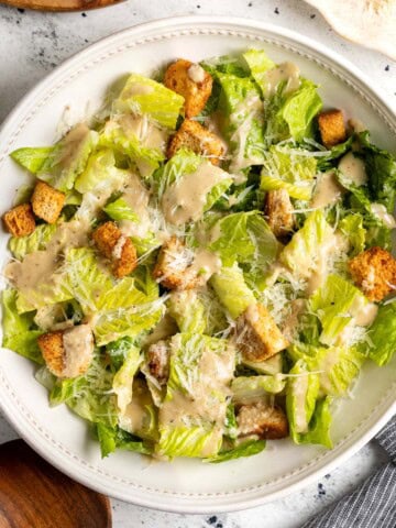A Caesar salad dressed with creamy Caesar vinaigrette.