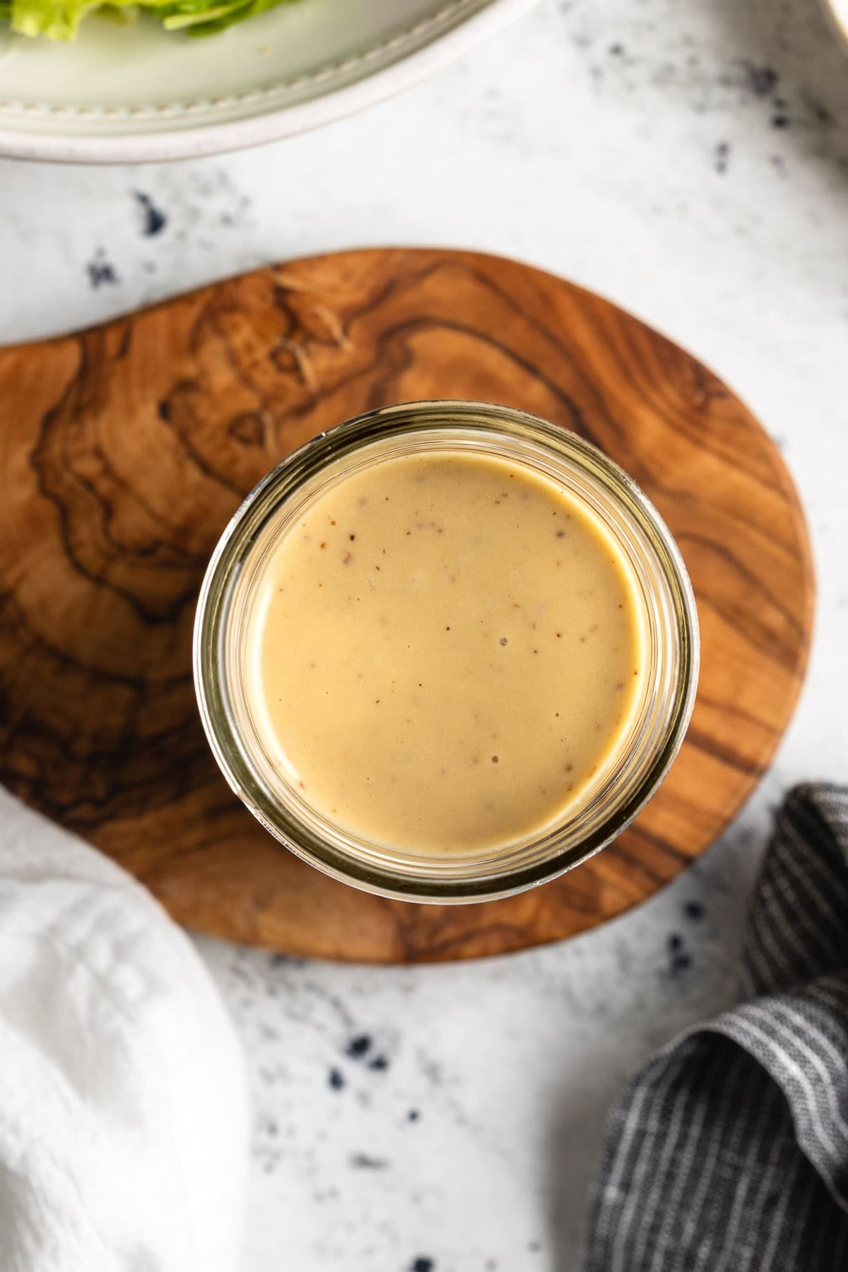 Caesar-inspired vinaigrette in a glass jar.