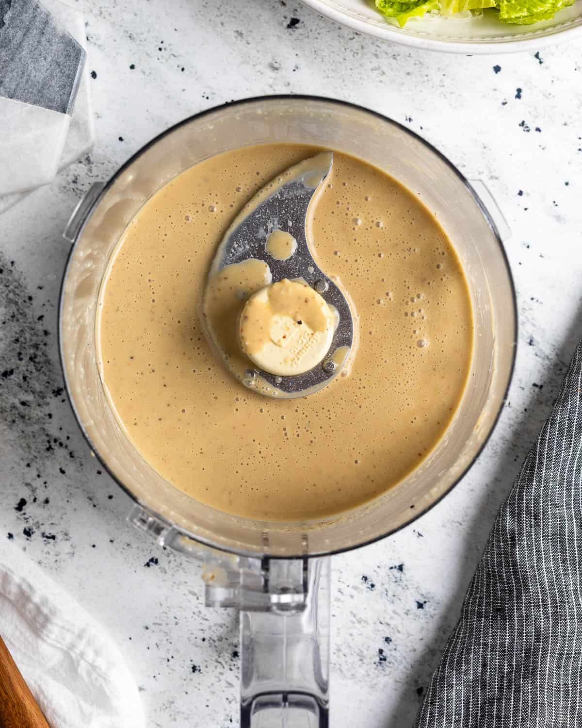 Smooth and creamy Caesar dressing in the food processor.