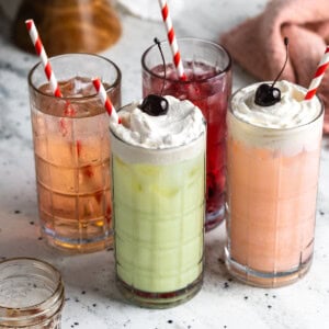 Italian sodas and Italian cream sodas in tall glasses with straws.