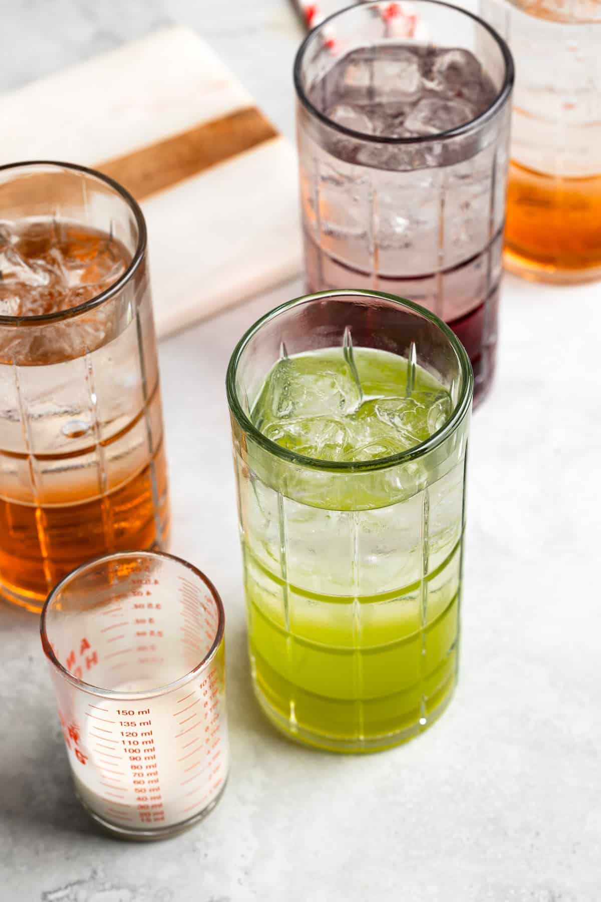 Club soda poured into the glasses over the ice and syrup.