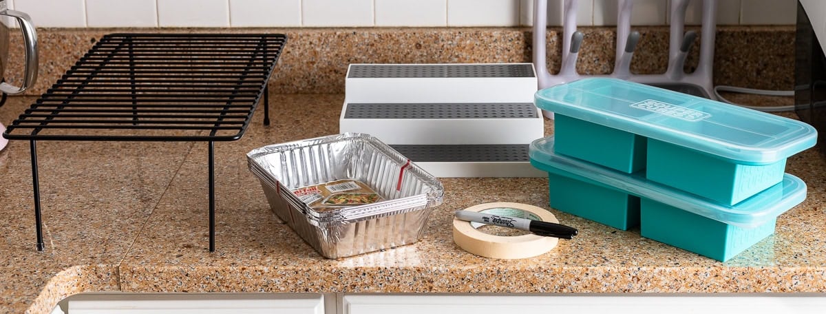 A variety of tools useful for preparing postpartum freezer meals and pantry organization.