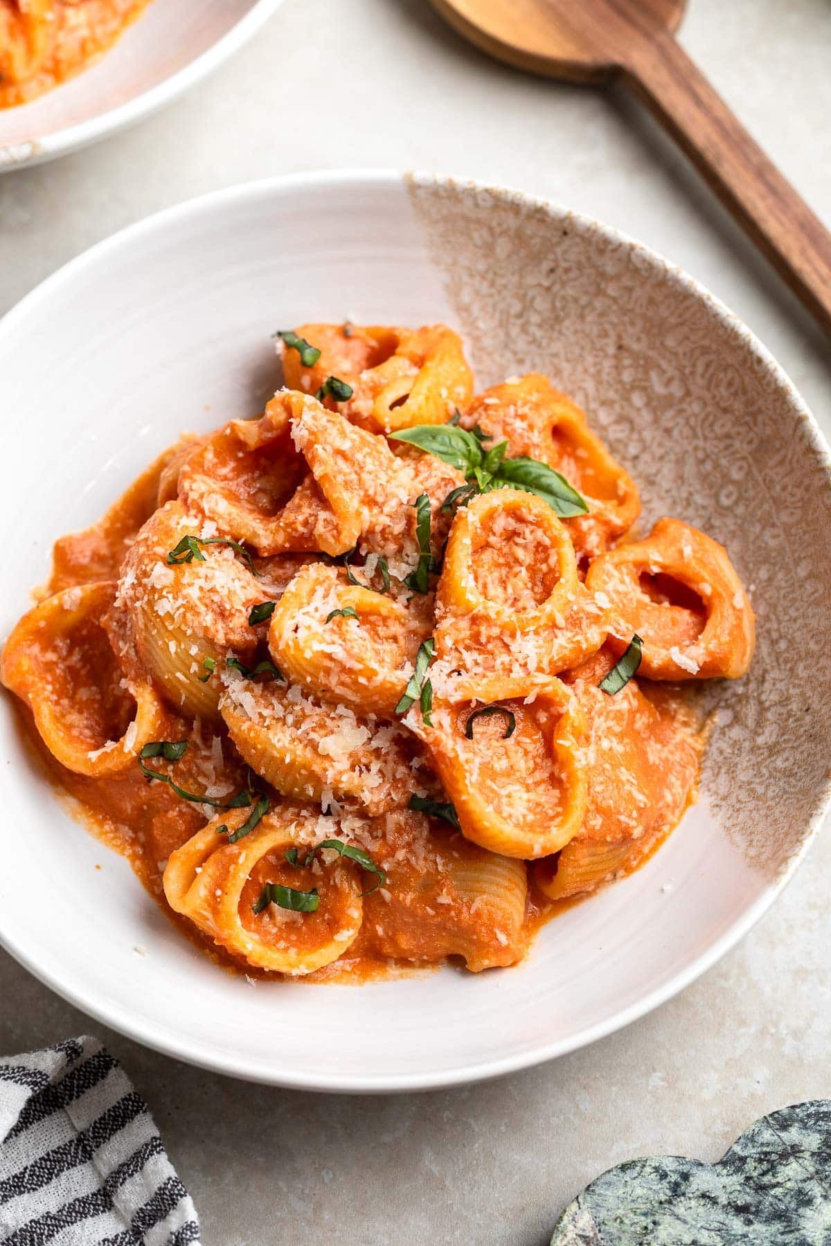 Lumaconi pasta coated with creamy vodka sauce made with Greek yogurt.