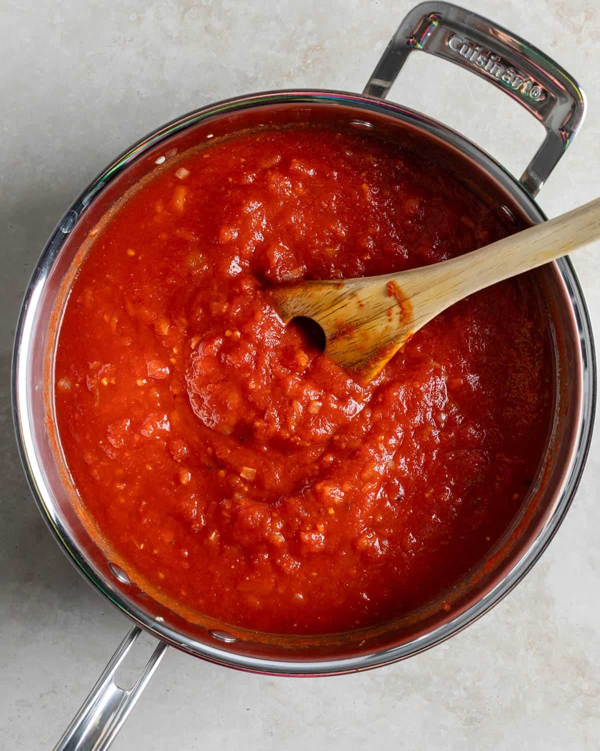 Crushed tomatoes and vodka added to the pan.