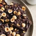 Crispy chocolate bark topped with toasted hazelnuts and whole espresso beans.