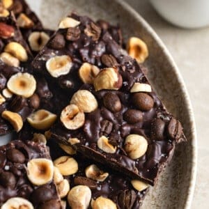 Crispy chocolate bark topped with toasted hazelnuts and whole espresso beans.