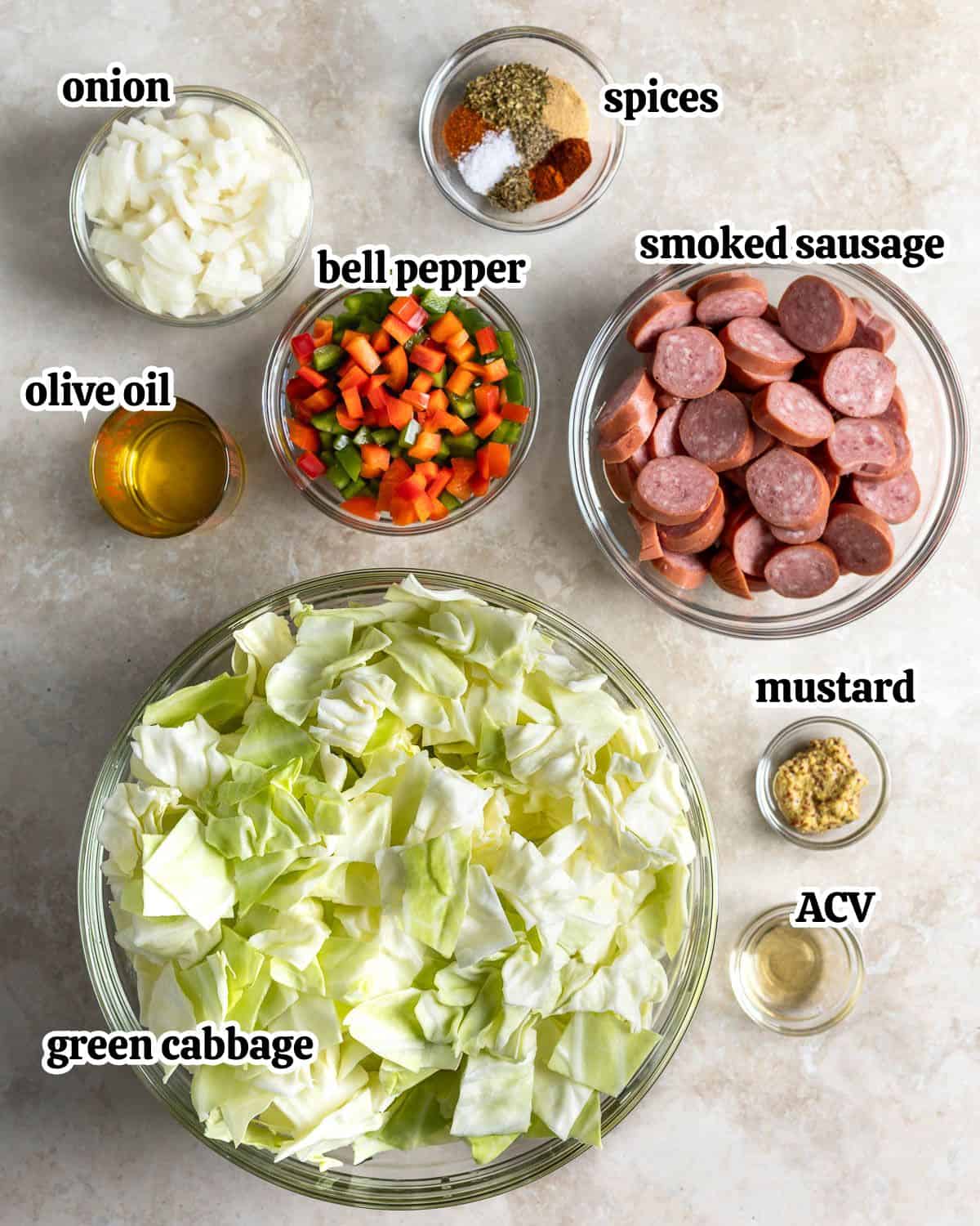 Text-labeled fried cabbage skillet ingredients in separate bowls.