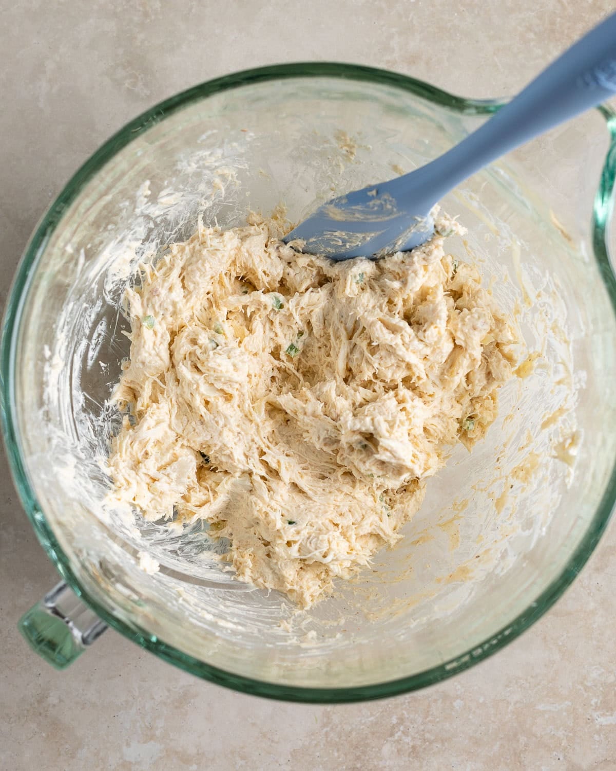 The crab dip mixture combined in a mixing bowl.