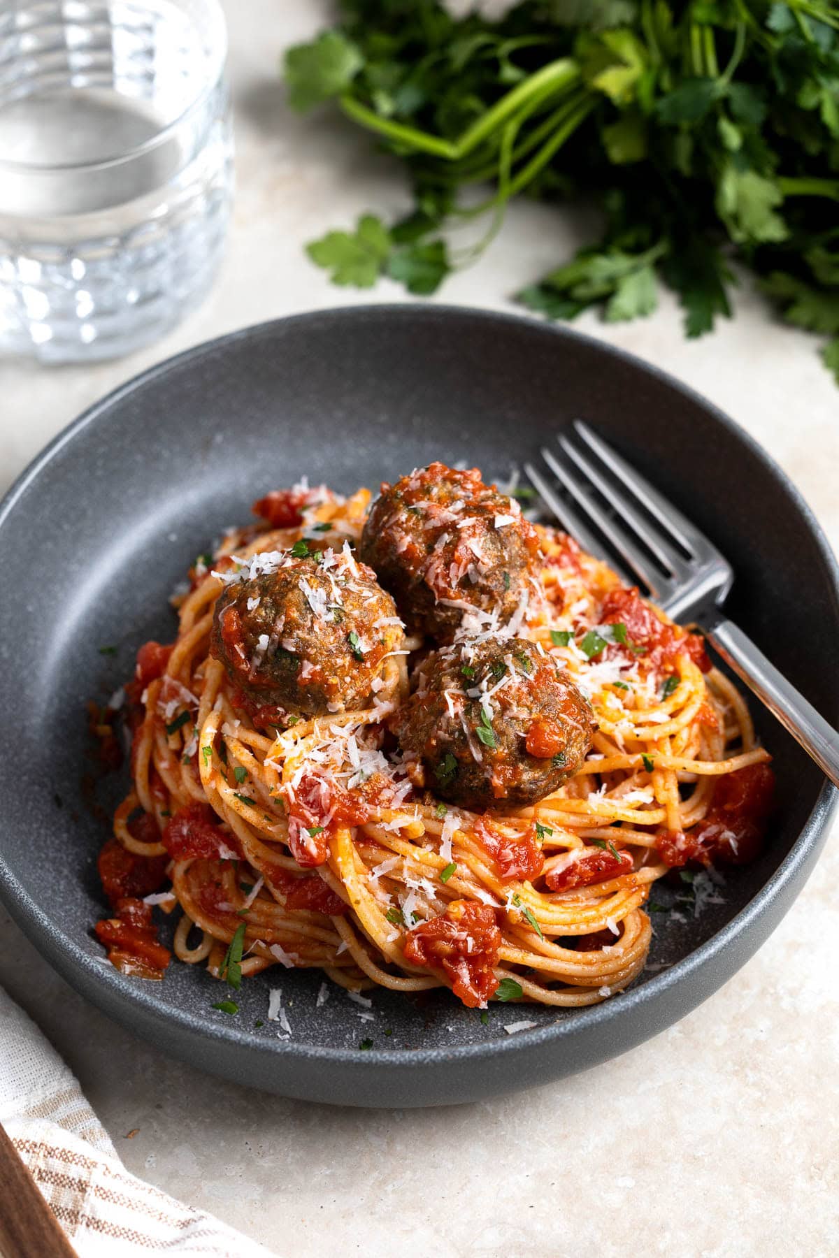 Spaghetti and meatballs coated in marinara sauce.