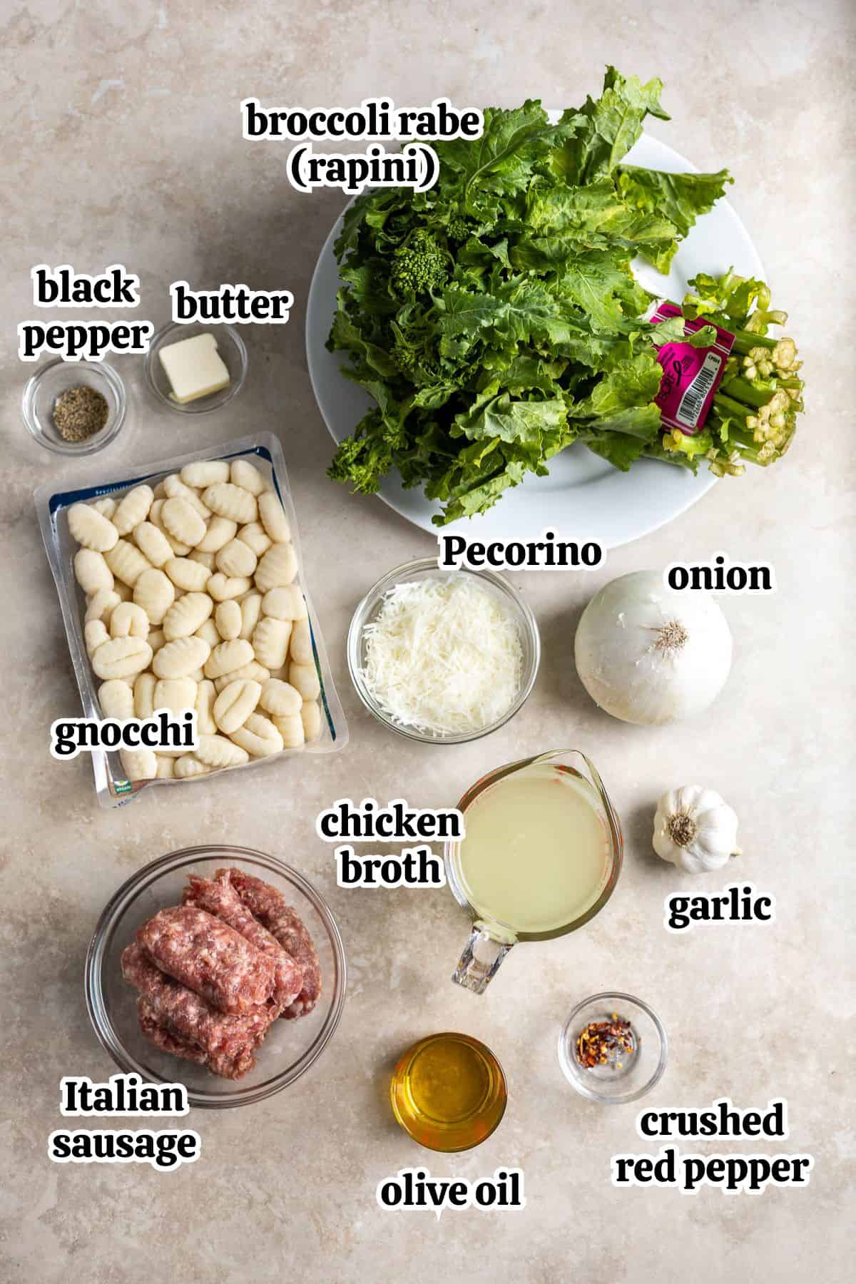 Text-labeled gnocchi with sausage and broccoli rabe ingredients in separate containers.