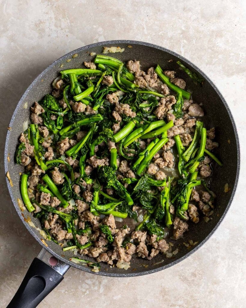Broccoli rabe wilted down in the pan.