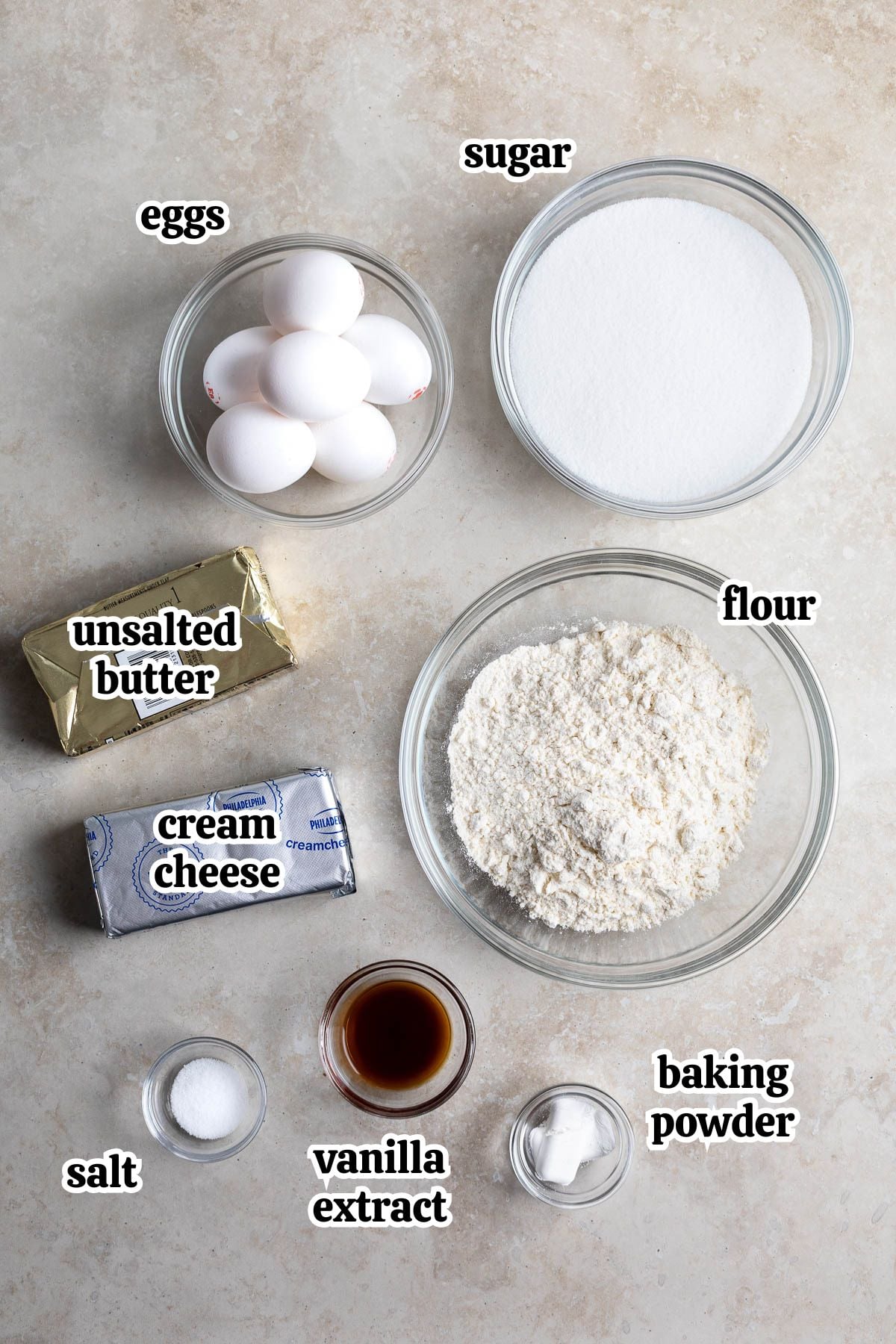 Philly fluff cake ingredients text-labeled in separate bowls.