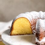 A cross-section of a Philly fluff cake, dusted with powdered sugar.