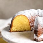 A cross-section of a Philly fluff Bundt cake, dusted with powdered sugar.