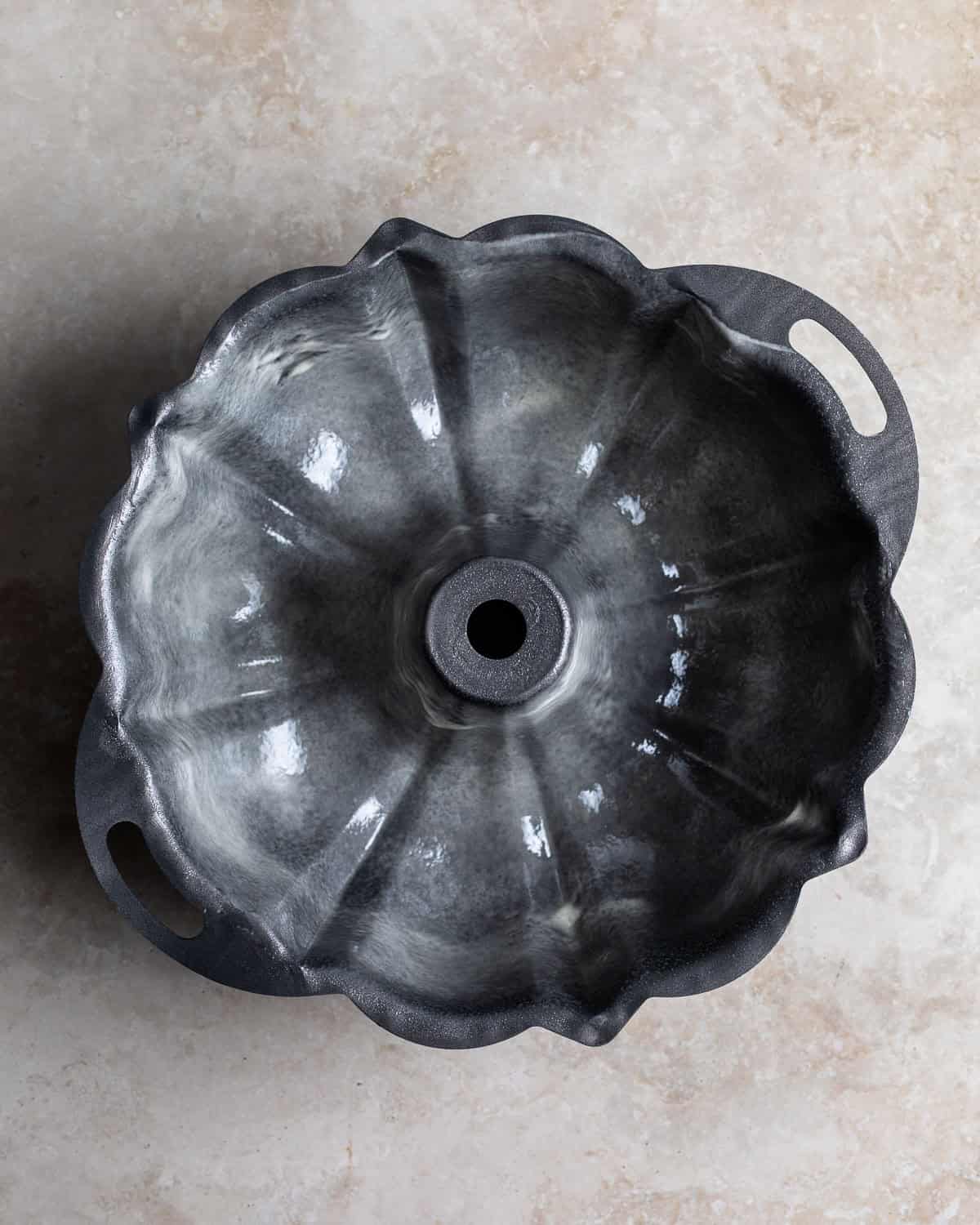 A greased and floured Bundt pan.