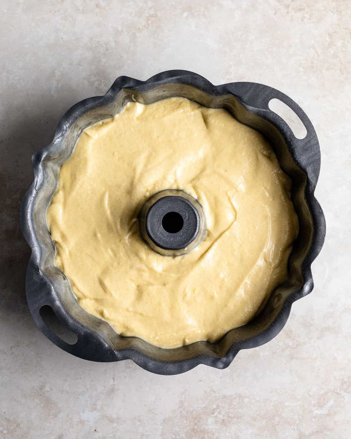 Philly Fluff batter poured into a prepared Bundt pan.